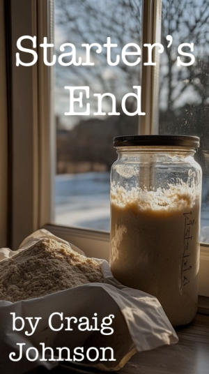 A jar of sourdough starter sitting in a window sill.